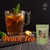 Desir Tea Peach Tea next to a glass mug of iced peach tea with fresh peach slices and a mint sprig.