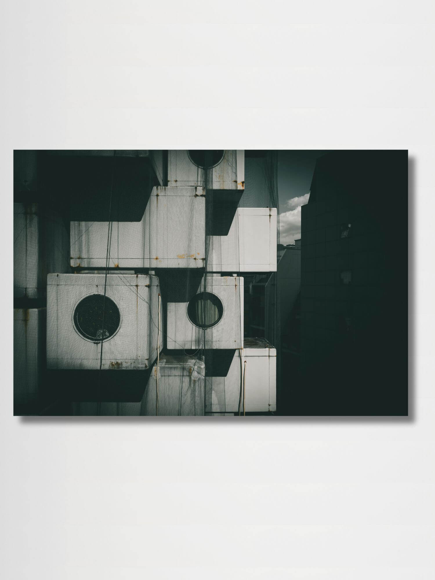 Capsule life, Tokyo    Japanese wall art decor poster Nakagin Tower in upscale Ginza district of Tokyo, Japan designed by architect Kisho Kurokawa. Completed in two years from 1970 to 1972, Dystopia building architecture Japan posters prints in black and white