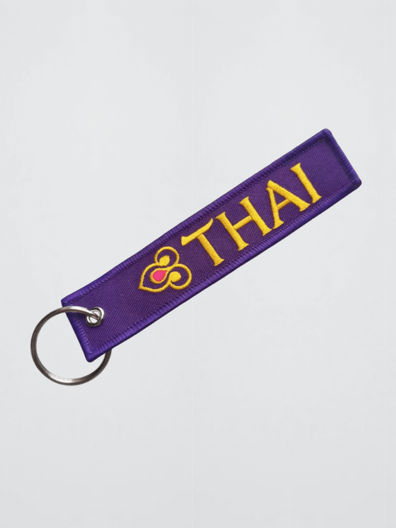 Thai Airways Keychain Embroidered logo with stainless steel silver metal clip Key Chain Airplane Keychains Flight Crew Pilot Aviation memorabilia in purple with yellow gold embroidery accent