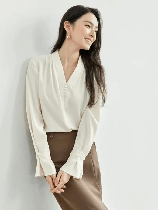Folds V-Neck Chiffon Top apricot     Women's straight fit V Neck long flare sleeves with slight dropped shoulders and wide banded pearl button cuffs elegant Shirts Tops for woman in apricot Spring womens office Lady wfh workwear fashion Holiday getaway vacation Blouses  #151V56992