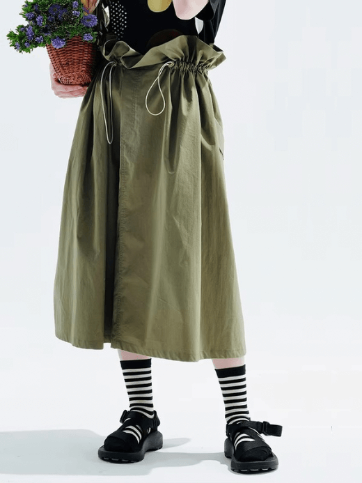 The Covent Garden Skirt     Women’s boho drawcord tie back pleated folds A-line bohemian mid-calf cotton-blend natural waistline midi skirts for woman in military olive green Japanese London bohemia look womens style fashion