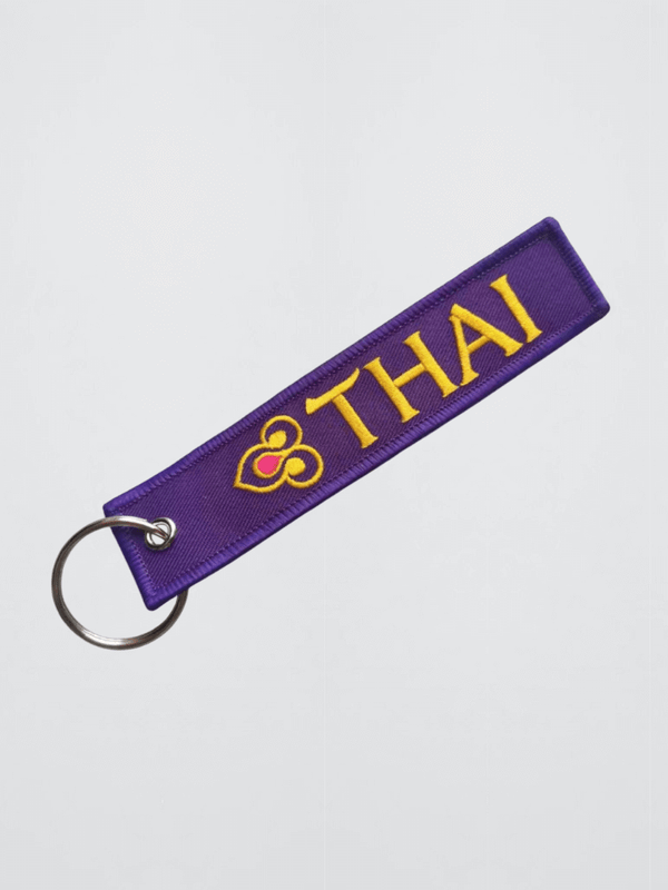 Thai Airways Keychain Embroidered logo with stainless steel silver metal clip Key Chain Airplane Keychains Flight Crew Pilot Aviation memorabilia in purple with yellow gold embroidery accent