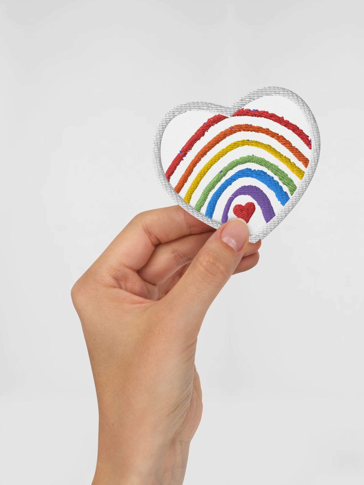 Rainbow Heart Embroidered Patch      Genderful Cartoon rainbow rainbows in white with multicolor pattern Anime Gifts love hearts rainbows lgbtqia+ Iron-on, sew-on, or safety pin attachment patches