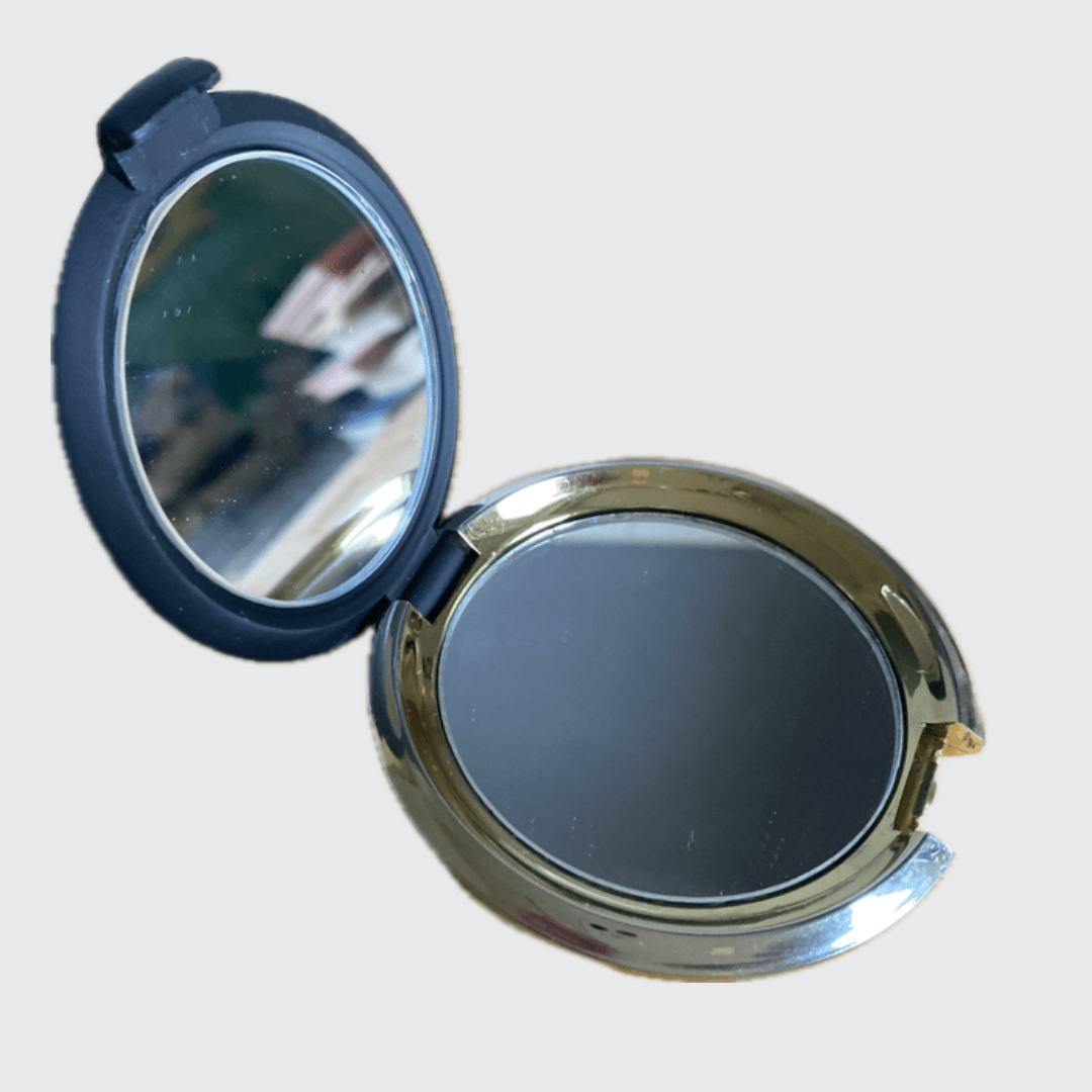 Compact Vanity Mirror   A vintage classic cosmetic make-up travel getaway vacation holiday round folding latch closure beauty skincare mirrors in black non-slip with golden metal collectors antique collectible fashion style