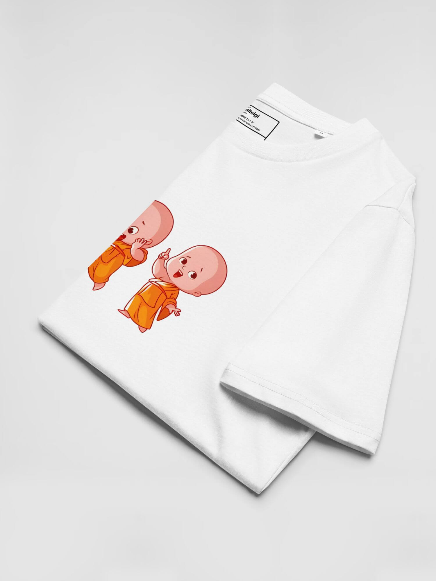 Happy Little Monk Organic Cotton T-Shirt       Unisex anywear Women’s Men's Short Sleeves o-neck casual solid white color with orange pastel multicolor design Thai anime monks character Tops womens mens crew neck round T-Shirts for tall-, plus-, size man woman Thailand Buddhist characters tees smiling faces