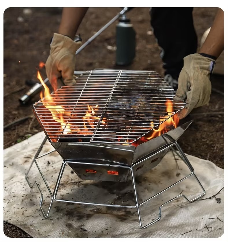 Outdoors Camping Portable Stainless Steel Folding BBQ Barbecue Grill for Outdoor Camping, Self-Driving Campsite Fire Pit & Campfire Stove in silver with carry bag