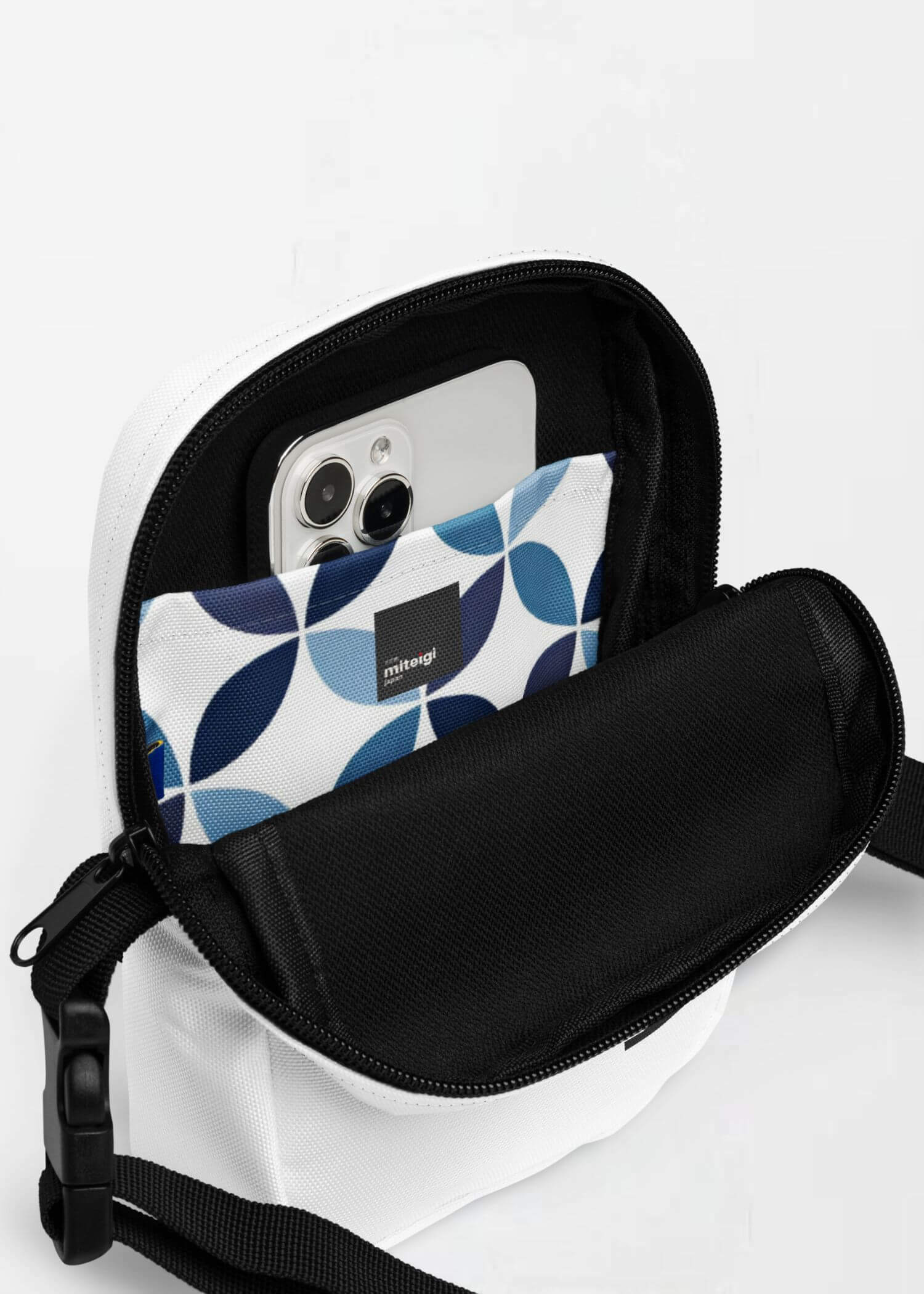 Utility Crossbody Bag miteigi Logo indigo   Unisex Men’s Women’s everyday use Japanese shoulder bags Luggage for man woman in white with black design and blue patchwork circles pattern highlights womens mens accessory