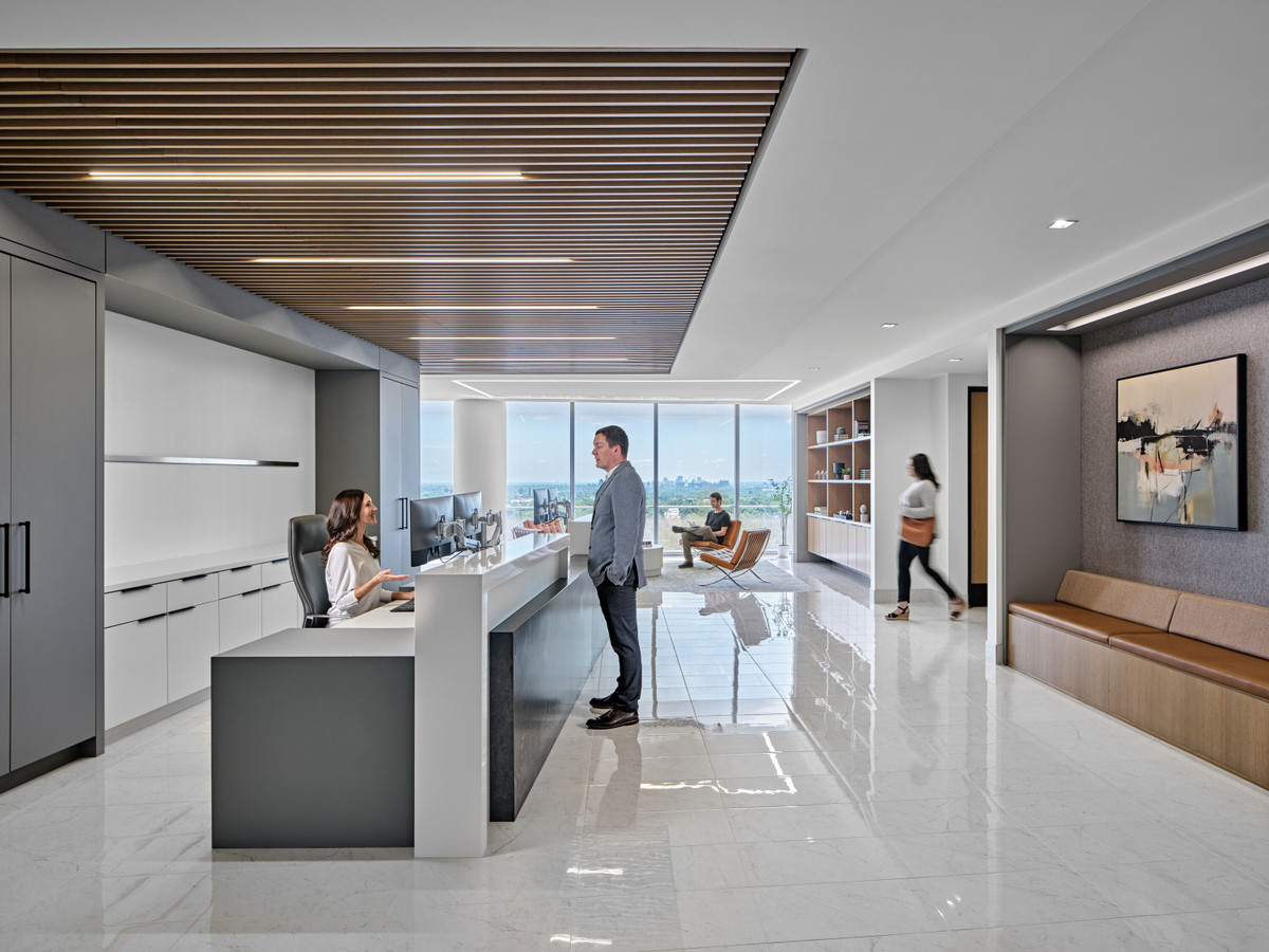 Reception desk and waiting area in a four-floor financial services headquarters