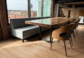 Cafe table and booth seating at a One Hope United location