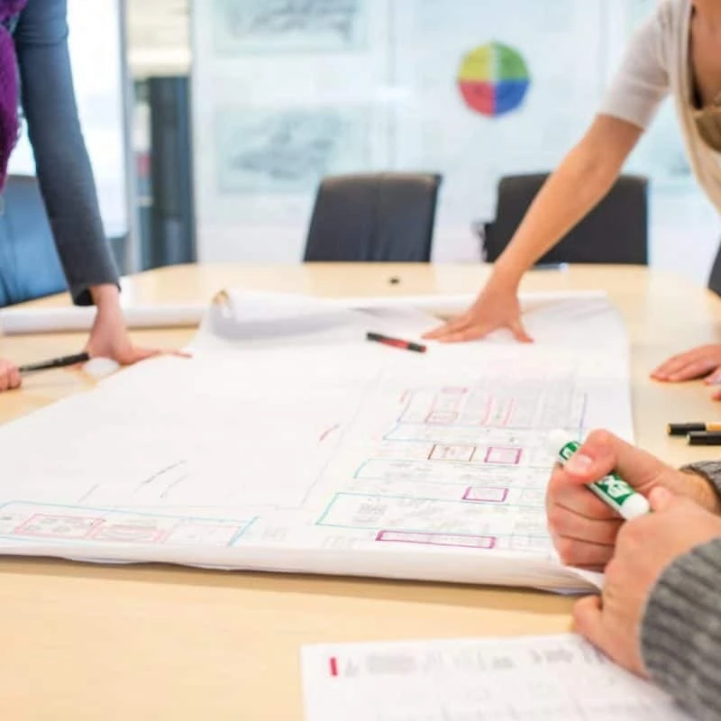 Office furniture team reviewing space plans for a workplace project