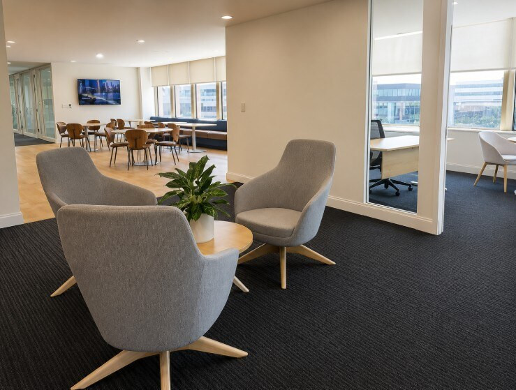 Agellus Capital headquarters collaboration space with lounge chairs and adjacent meeting areas