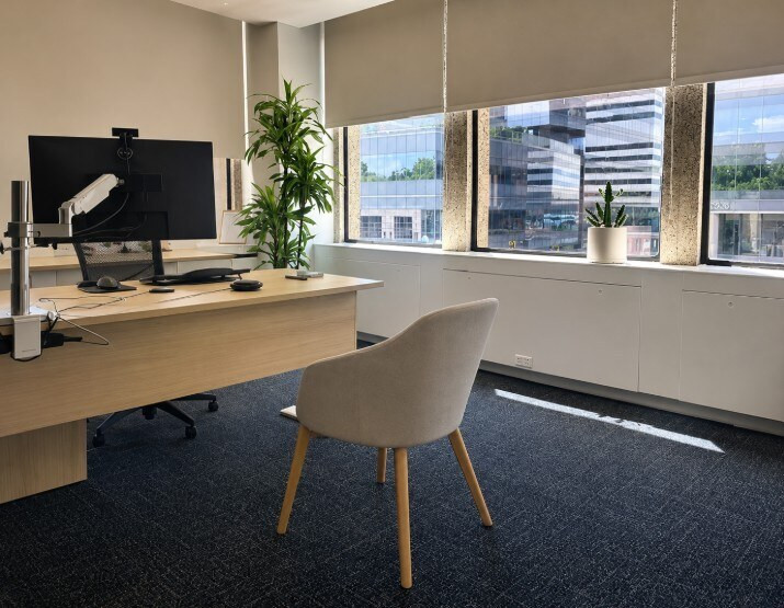 Agellus Capital headquarters private office with modern desk and guest seating