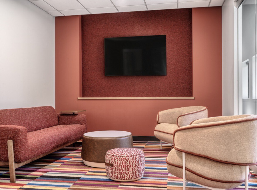 Foster and Adoptive Care Coalition headquarters lounge with colorful refurbished furniture