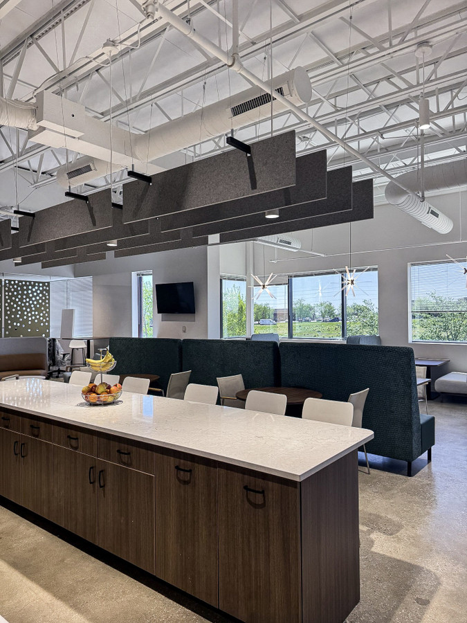Gateway Fiber breakroom with communal table and high-back booth seating