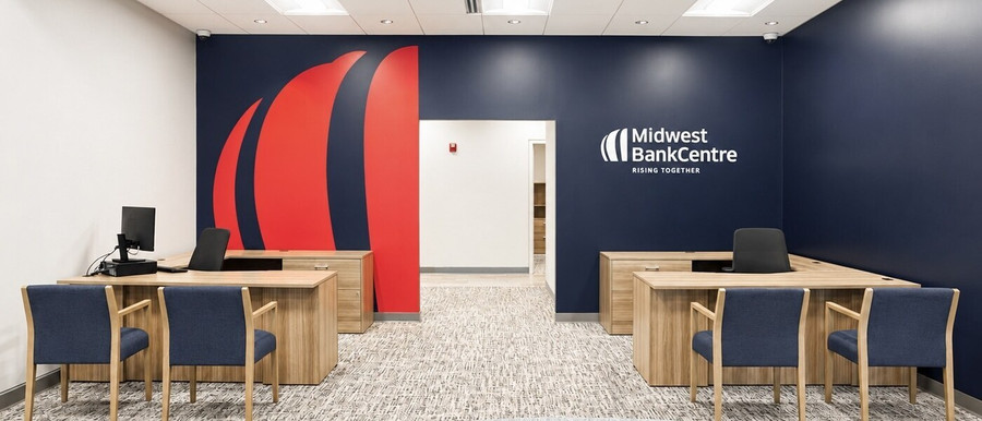 Midwest BankCentre Frontenac main lobby with branded wall and client meeting tables