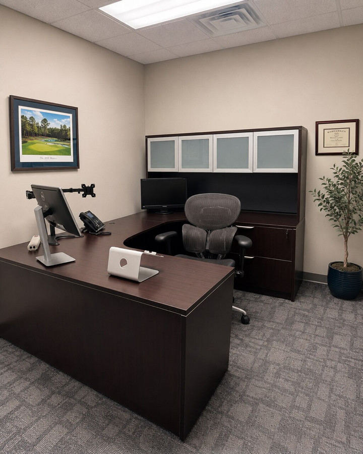 StrategiCom private office with reused desk and coordinated storage