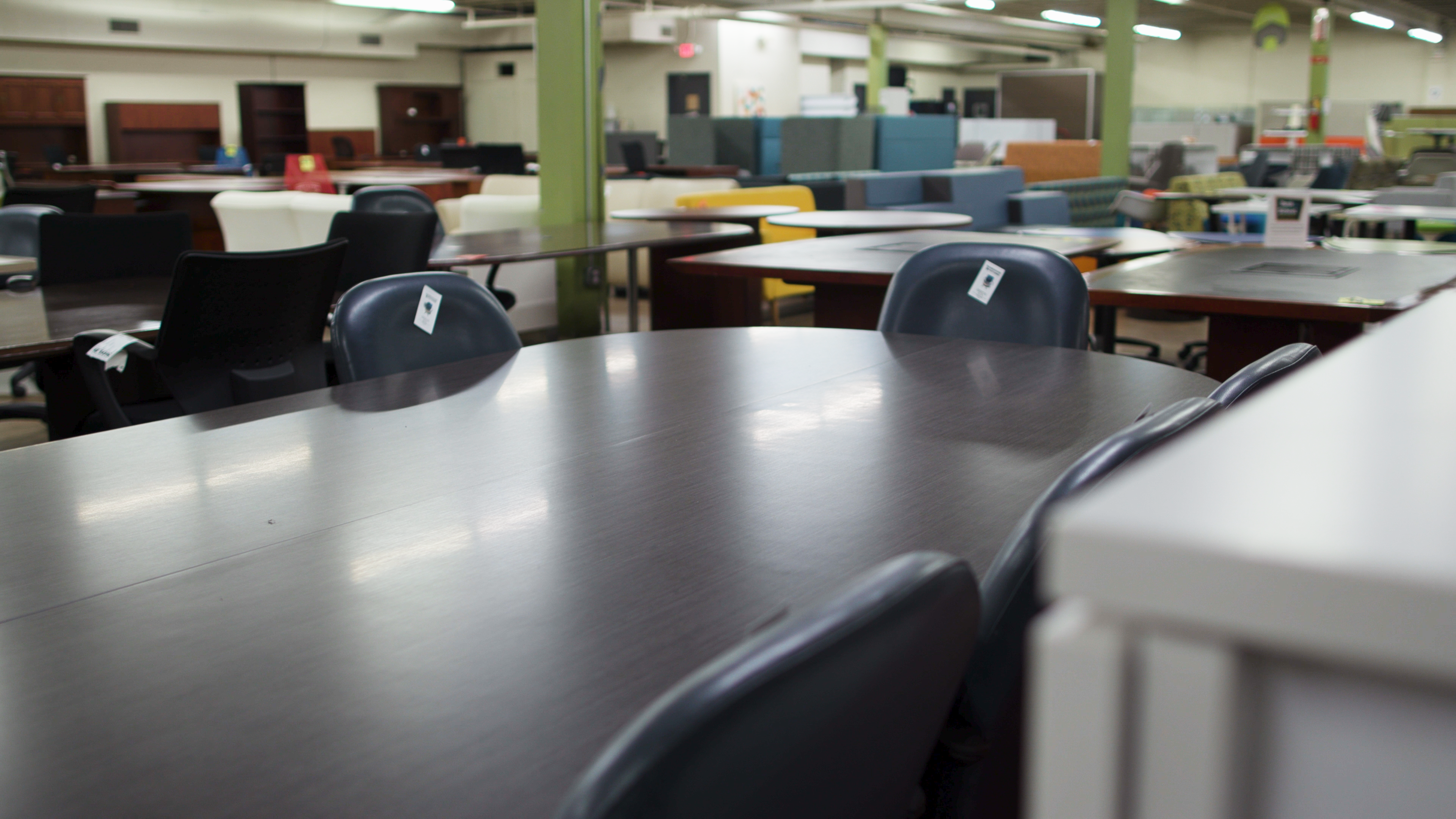 Used conference and office tables in St. Louis showroom
