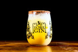 York Gin Chocolate & Orange snowball cocktail in branded tumbler on dark background.