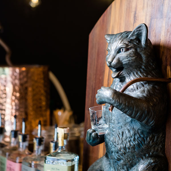 The bell rings behind the Puss and Mew sculpture