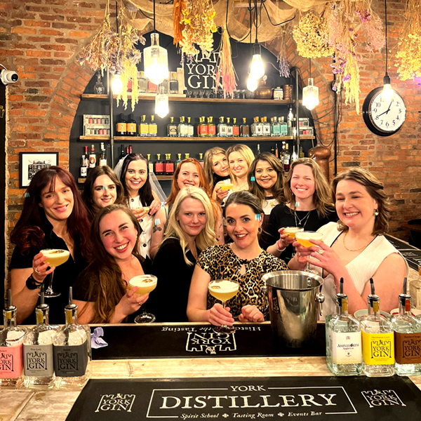 Guests enjoying a cocktail making party at York Distillery, a home of York Gin, York city centre