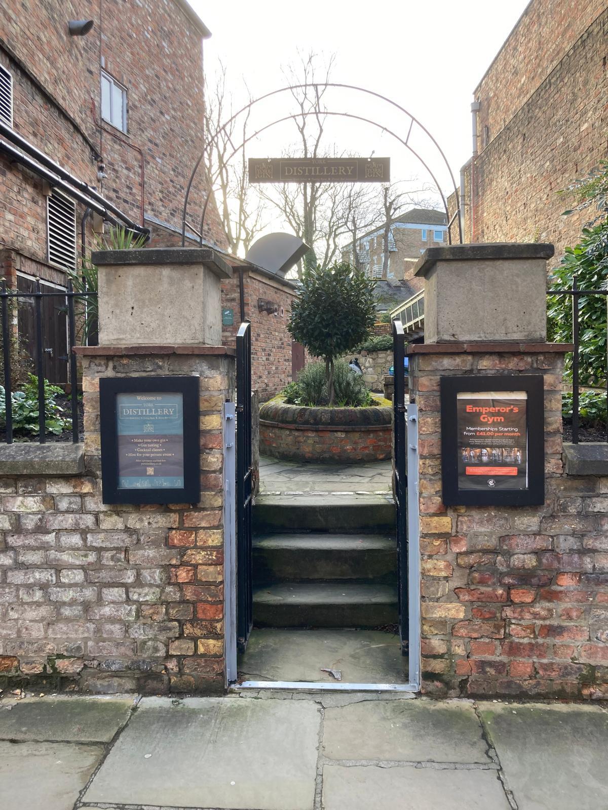 The entrance to York Distillery on Skeldergate — the small raised-bed garden shared with Emperor's Gym