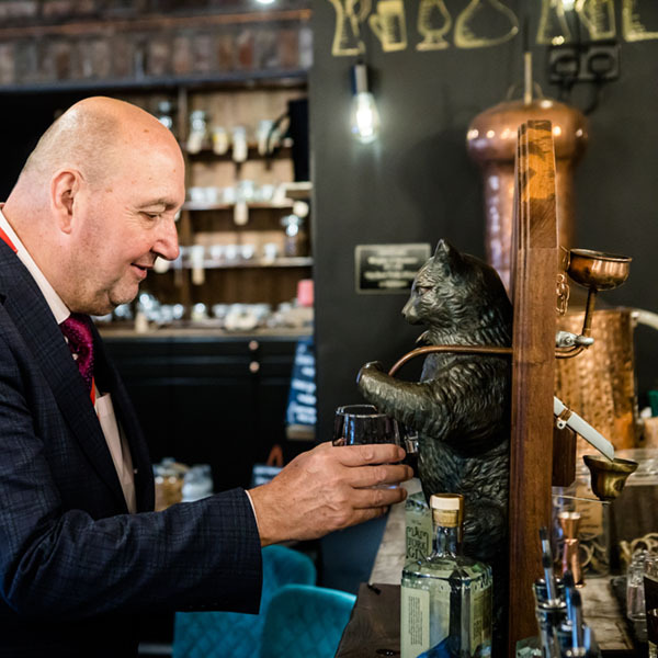 York Gin Old Tom flowing from the paw of the Puss and Mew sculpture