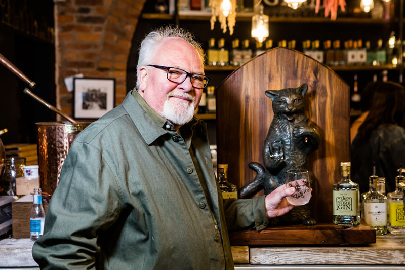 Jonathan Newdick, sculptor, with the Puss and Mew at York Distillery