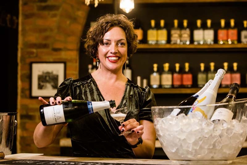 Pouring Champagne at York Distillery a home of YOrk GIn