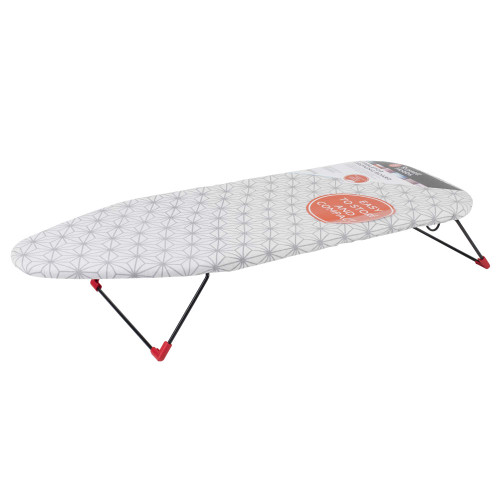 Grey tabletop ironing board with geometric pattern, foldable black legs and red feet.