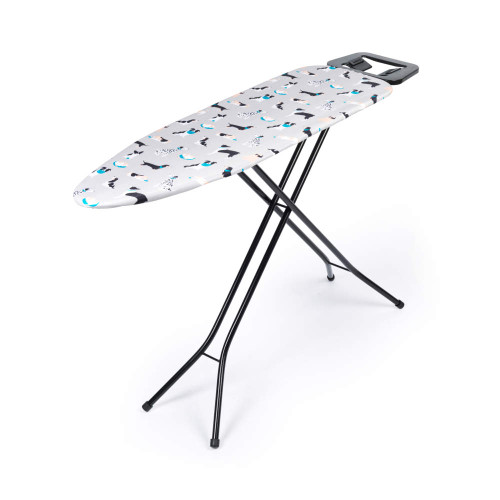 Grey ironing board with multicoloured dog print cover and black foldable legs