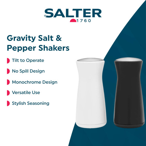 White and black gravity salt and pepper shakers with monochrome, no-spill design.