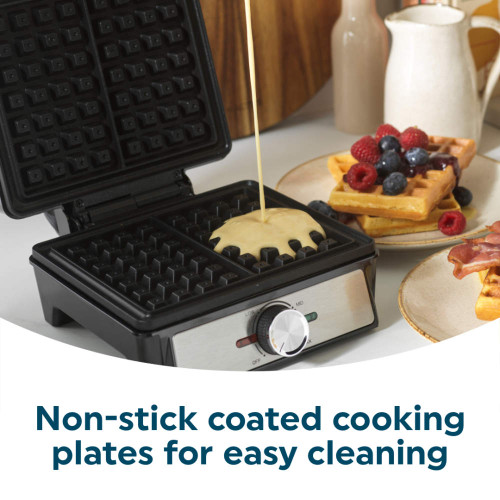 Open waffle maker with batter pouring onto non-stick plate