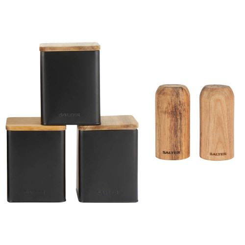 Set of three black storage canisters with wood lids and two wood salt and pepper shakers.