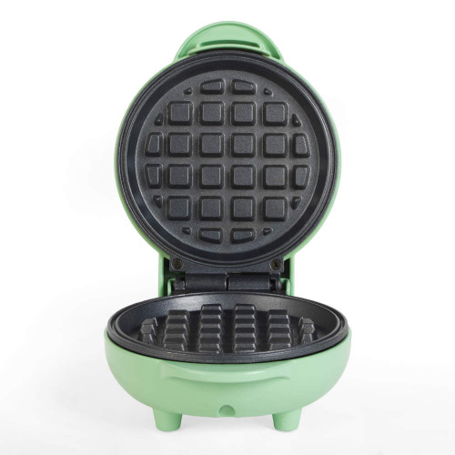 Green mini waffle maker open to show cooking plates
