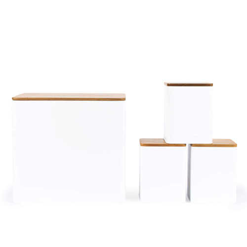 Set of four white kitchen storage canisters with bamboo lids, shown in different sizes.
