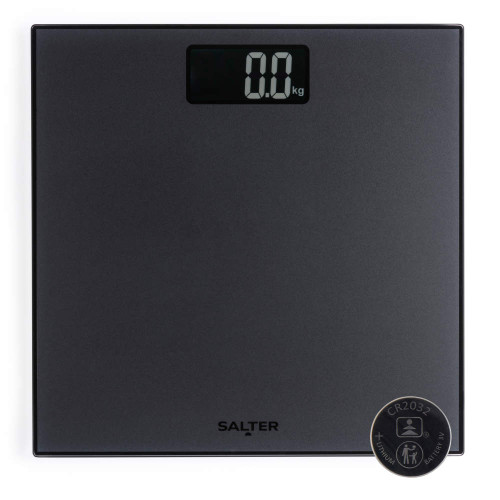 Black digital bathroom scale with display showing 0.0 kg and included CR2032 battery.