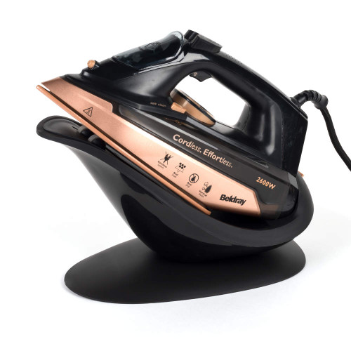 Rose gold and black cordless steam iron on charging base, product image for listing