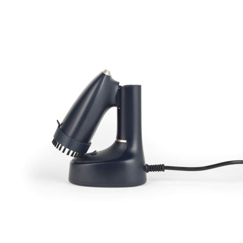 Navy handheld garment steamer with brush attachment on charging base