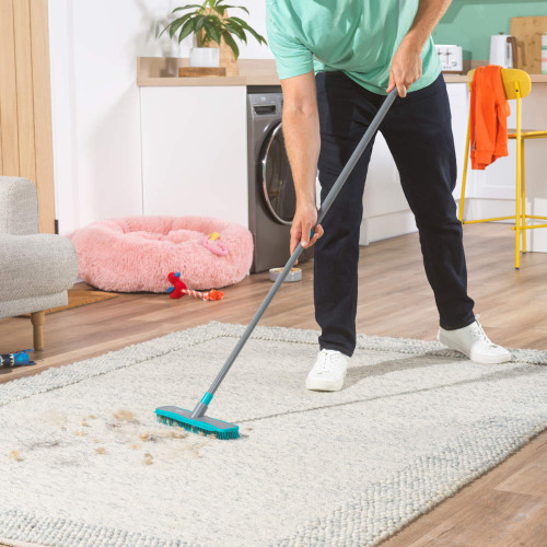Grey dual action rubber broom with anti-bac bristles and extra reach handle in packaging
