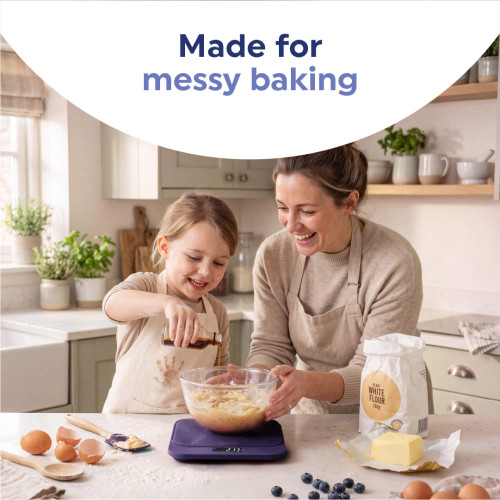 Adult and child baking together in kitchen with mixing bowl on digital scales