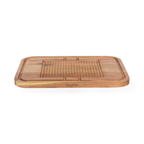 Large wooden carving board with crumb grooves and textured centre, shown from front angle.