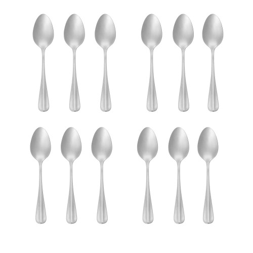 Set of 12 stainless steel dessert spoons arranged in rows on white background