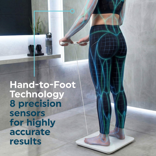 Person using digital bathroom scale with hand grips, highlighting sensor technology