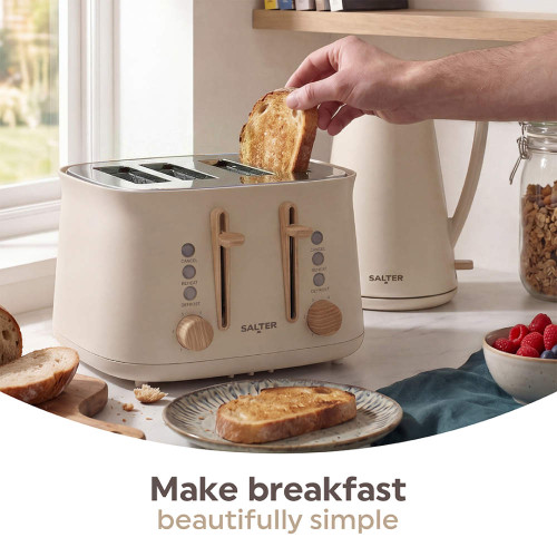 Stone 4-slice toaster with hand placing bread in slot