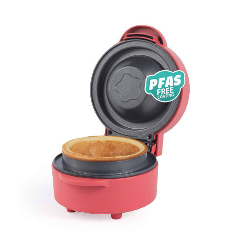 Open red pie maker with cooked pie inside