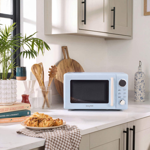 Light blue countertop microwave in a modern kitchen