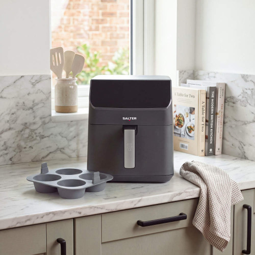 Grey Salter air fryer on kitchen counter with silicone tray