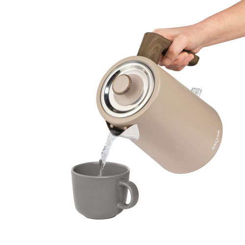 Mocha electric kettle pouring water into a grey mug