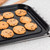 Chocolate chip cookies on baking tray, fresh from oven