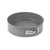 Grey non-stick round springform cake tin with latch, shown empty